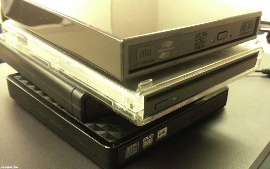 Obsolete stack of old CD and DVD drives