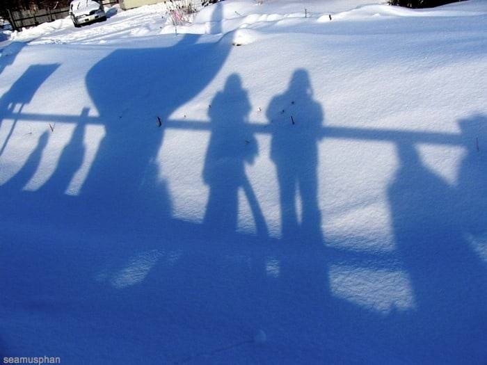 People's shadows in snowscape