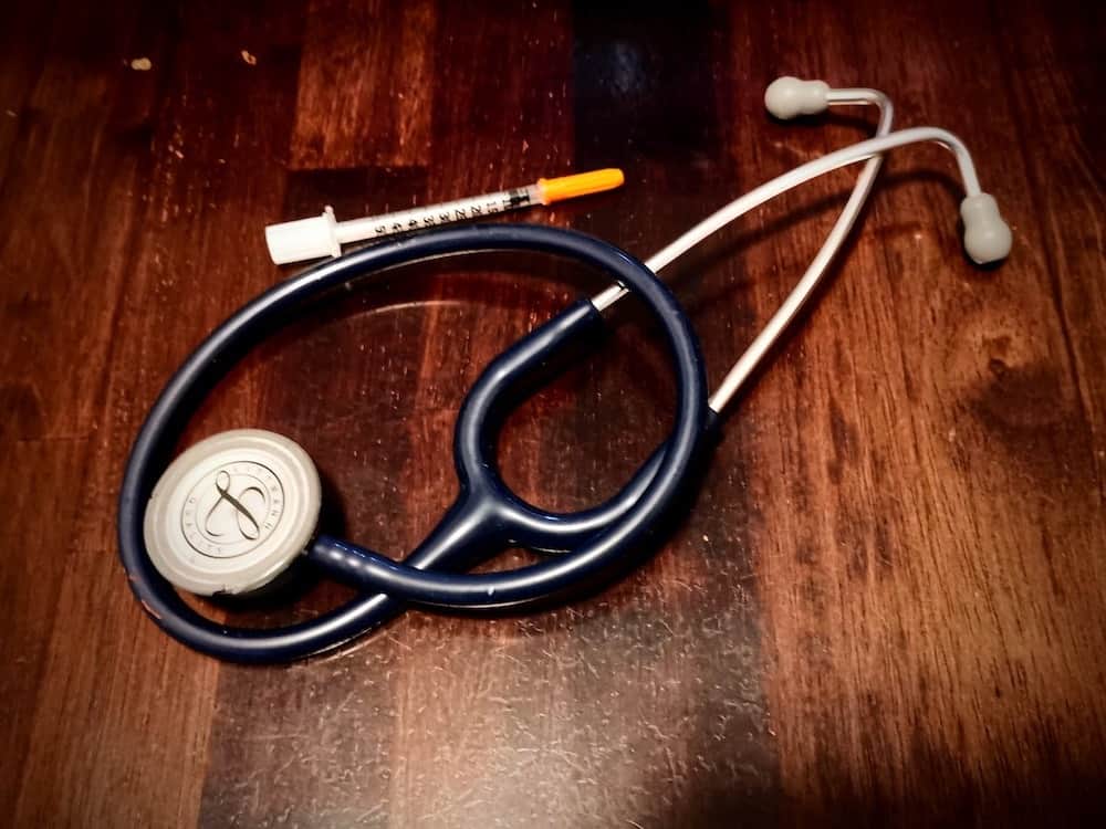 Medical Doctor's Stethoscope and Syringe